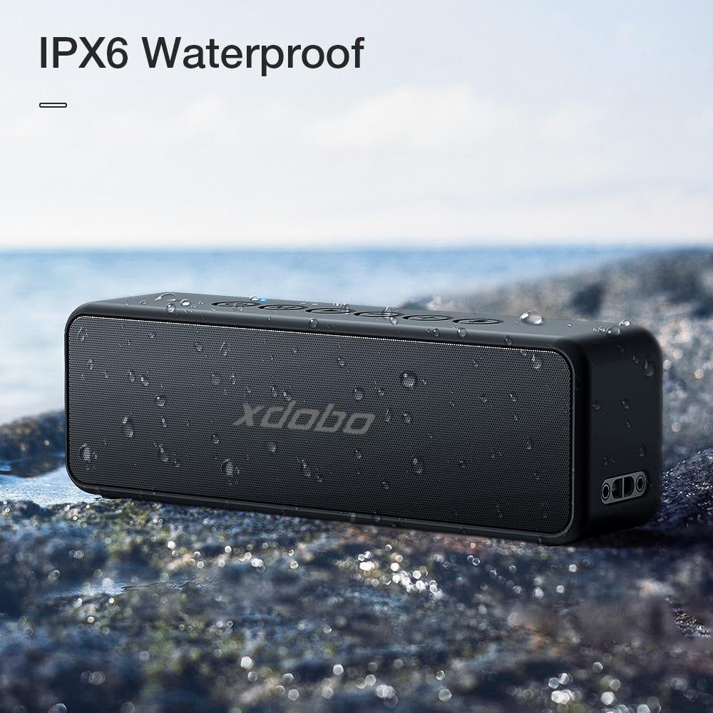 "Portable black waterproof 30W Bluetooth speaker with 4000mAh battery, dual drivers, compact for outdoor use."