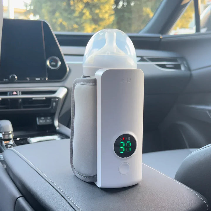"Portable rechargeable baby bottle warmer with digital display, compact design, BPA-free, USB charging, perfect temperature."