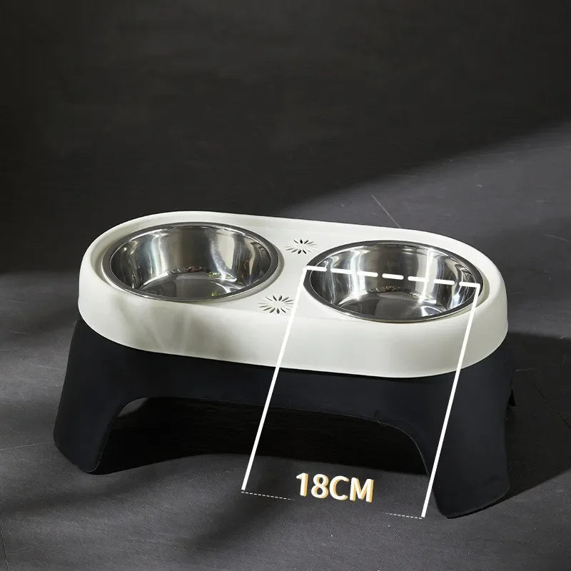 "Raised dog feeding station with sleek stainless steel bowls on a stable, non-slip base for mess-free, stylish dining."