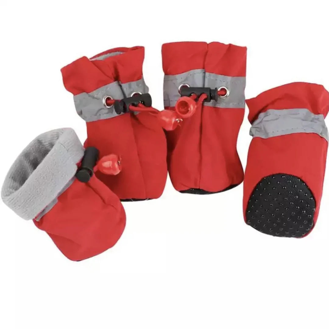 "Red winter dog boots with a non-slip sole, warm lining, and waterproof finish, perfect for cold, wet conditions."
