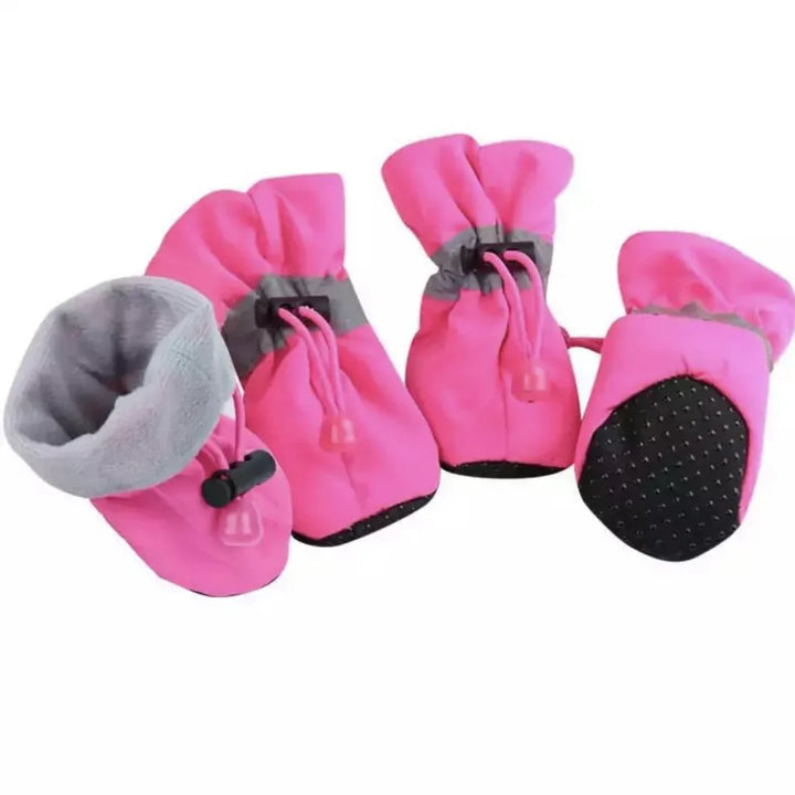 "Red winter dog boots with a non-slip sole, warm lining, and waterproof finish, perfect for cold, wet conditions."