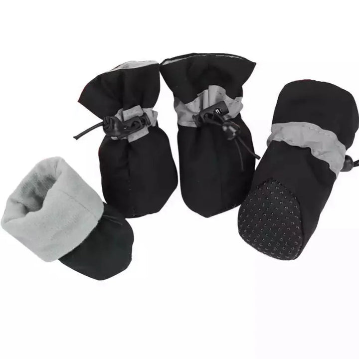 "Red winter dog boots with a non-slip sole, warm lining, and waterproof finish, perfect for cold, wet conditions."
