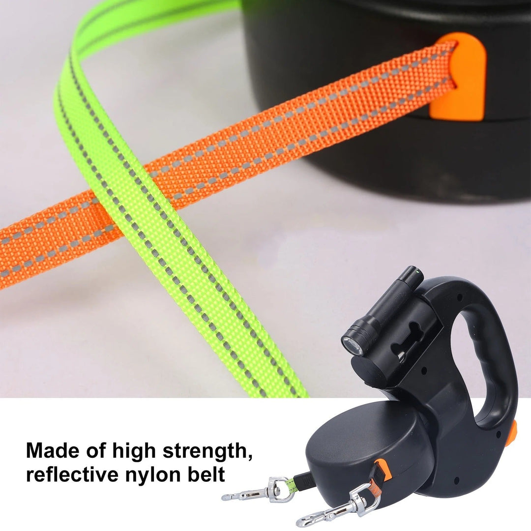 "Retractable double dog leash with flashlight, bag dispenser; durable nylon straps, ergonomic grip for tangle-free walking."