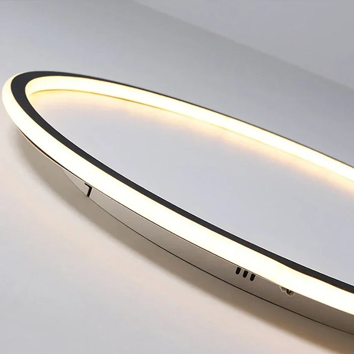 "Round LED ceiling light with Nordic design, offering soft illumination for modern living spaces, made of metal and glass."