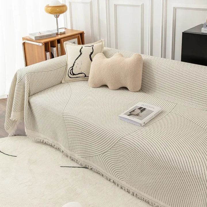 Scandinavian throw blanket with tassel edge, soft texture, cozy Nordic style, perfect for sofa decor and protection.