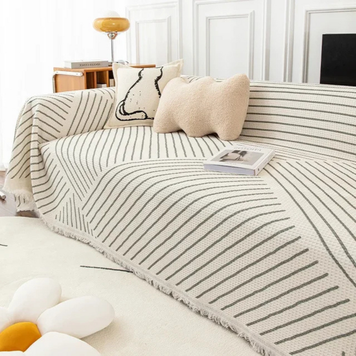 Scandinavian throw blanket with tassel edge, soft texture, cozy Nordic style, perfect for sofa decor and protection.