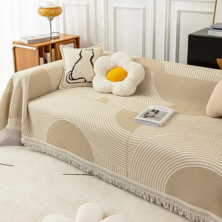 Scandinavian throw blanket with tassel edge, soft texture, cozy Nordic style, perfect for sofa decor and protection.