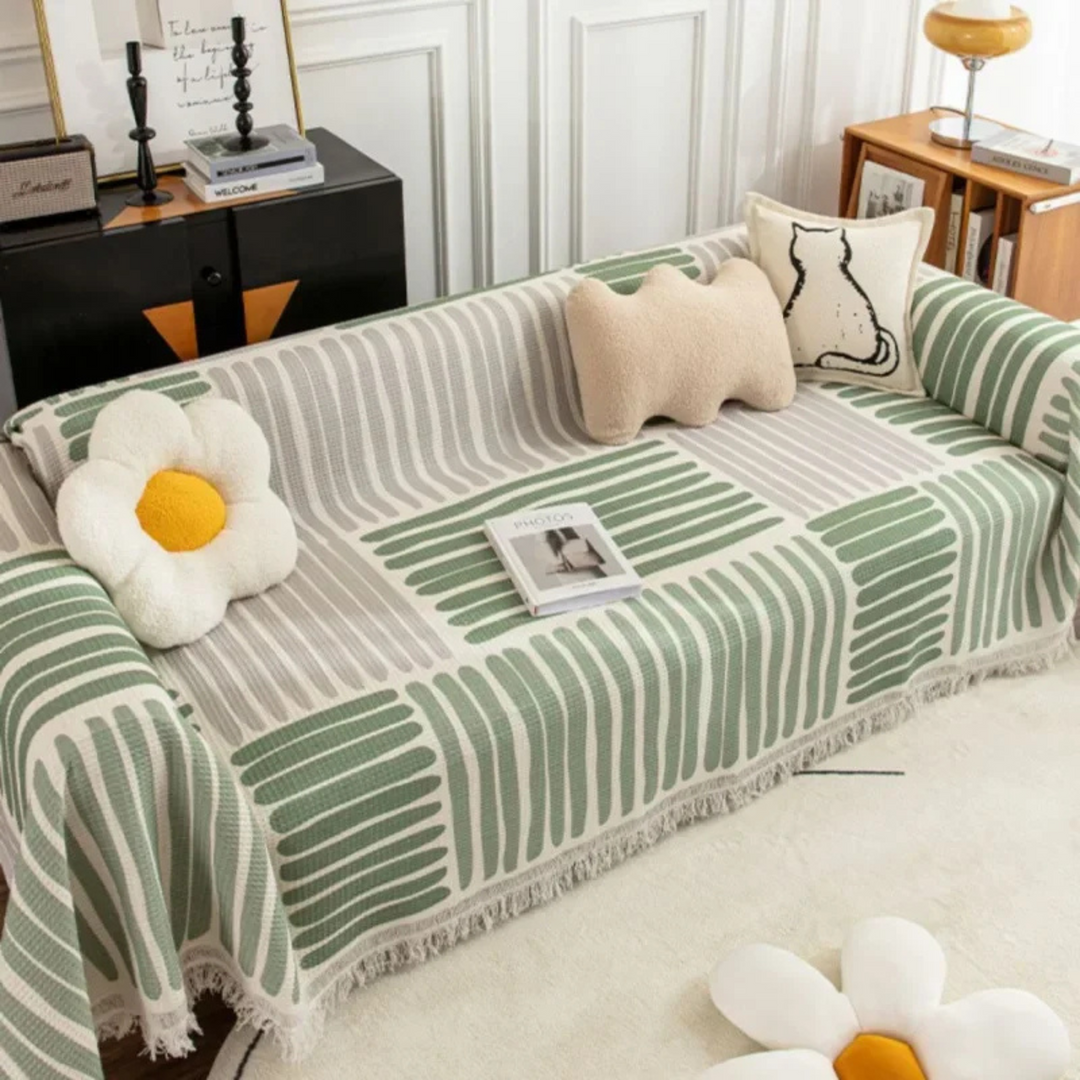 Scandinavian throw blanket with tassel edge, soft texture, cozy Nordic style, perfect for sofa decor and protection.