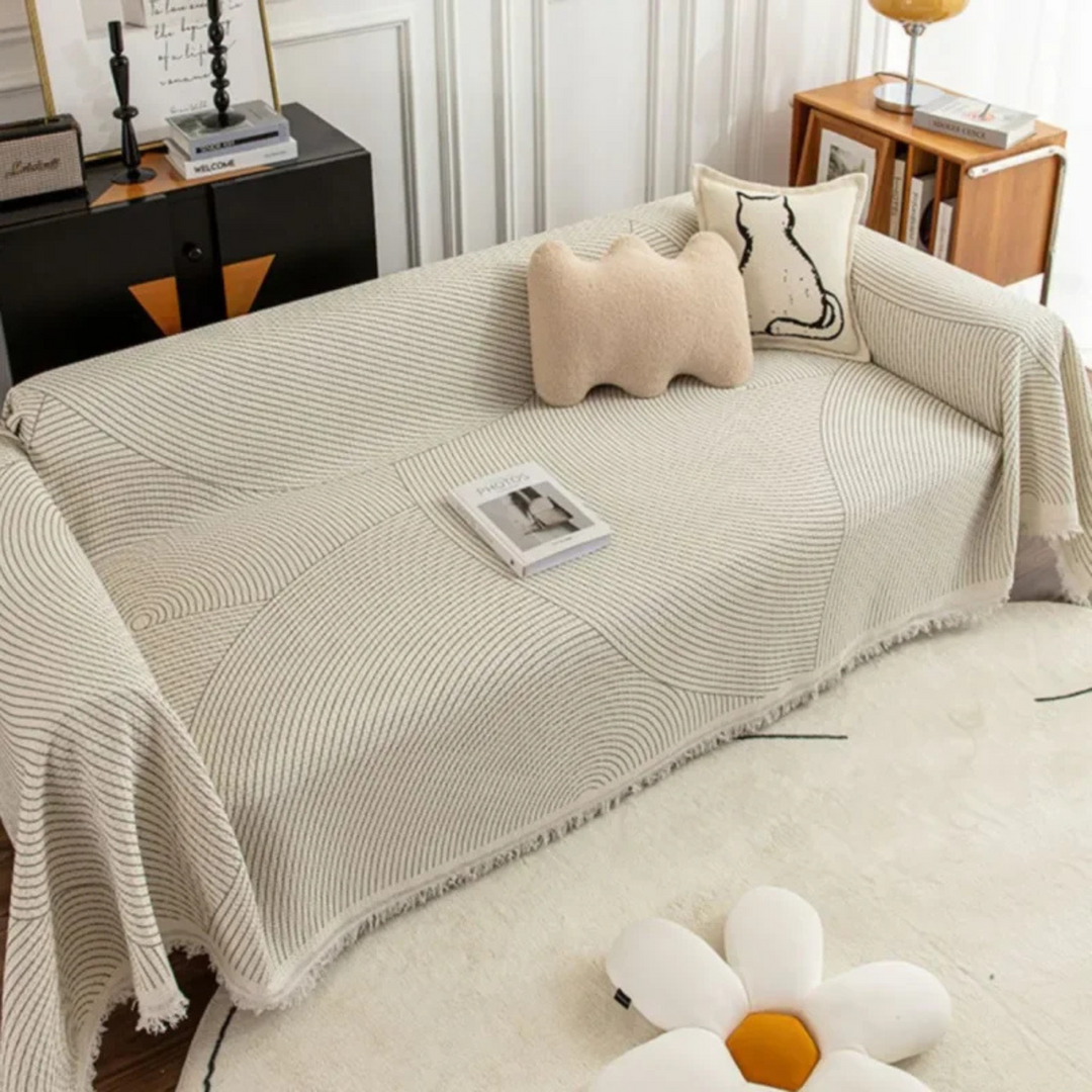 Scandinavian throw blanket with tassel edge, soft texture, cozy Nordic style, perfect for sofa decor and protection.