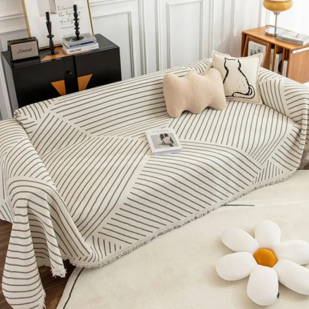 Scandinavian throw blanket with tassel edge, soft texture, cozy Nordic style, perfect for sofa decor and protection.