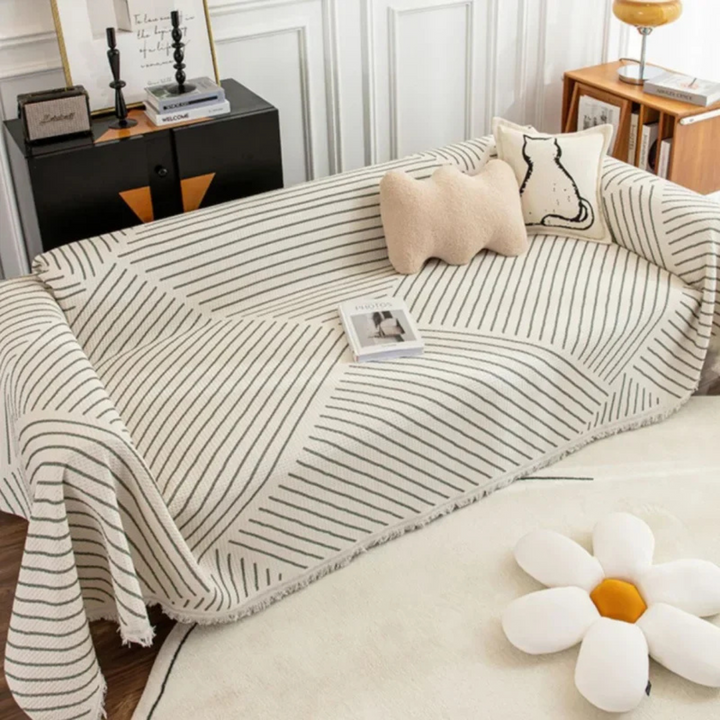 Scandinavian throw blanket with tassel edge, soft texture, cozy Nordic style, perfect for sofa decor and protection.