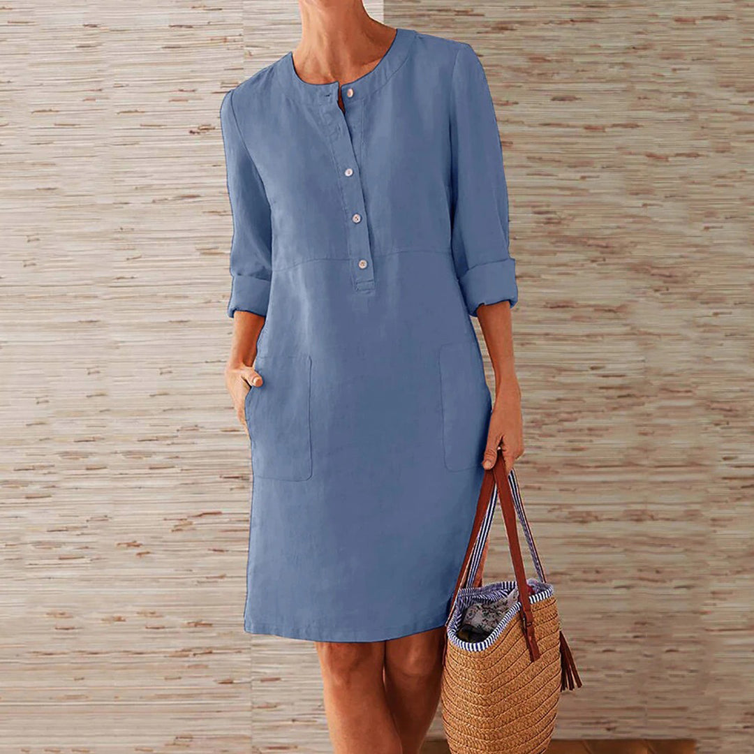 Sky blue women's casual midi dress with long sleeves and side pockets, featuring a round neckline, perfect for everyday wear.