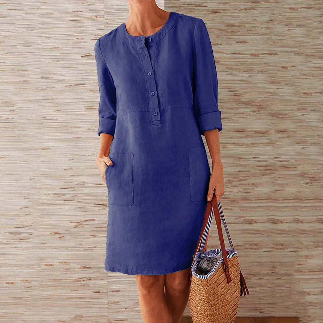 Sky blue women's casual midi dress with long sleeves and side pockets, featuring a round neckline, perfect for everyday wear.