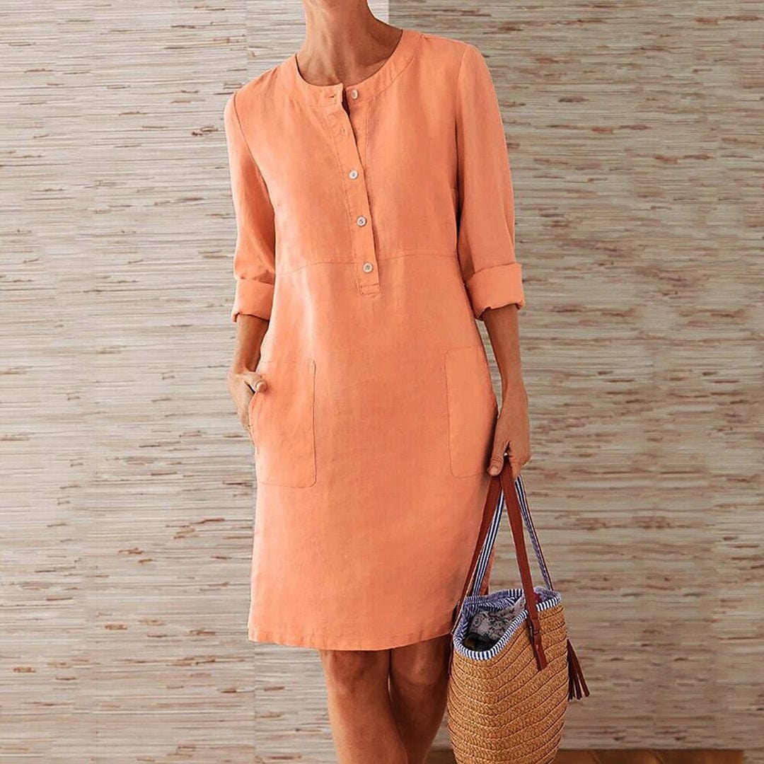 Sky blue women's casual midi dress with long sleeves and side pockets, featuring a round neckline, perfect for everyday wear.