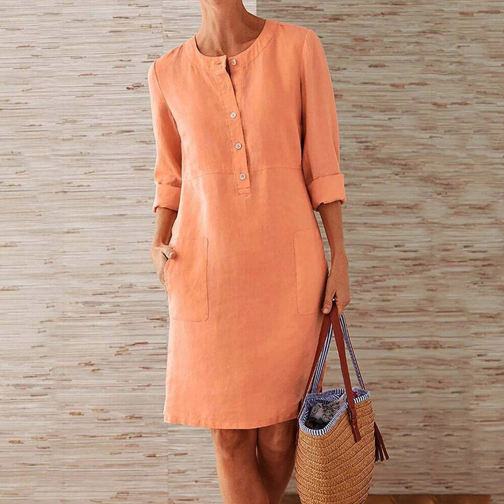 Sky blue women's casual midi dress with long sleeves and side pockets, featuring a round neckline, perfect for everyday wear.