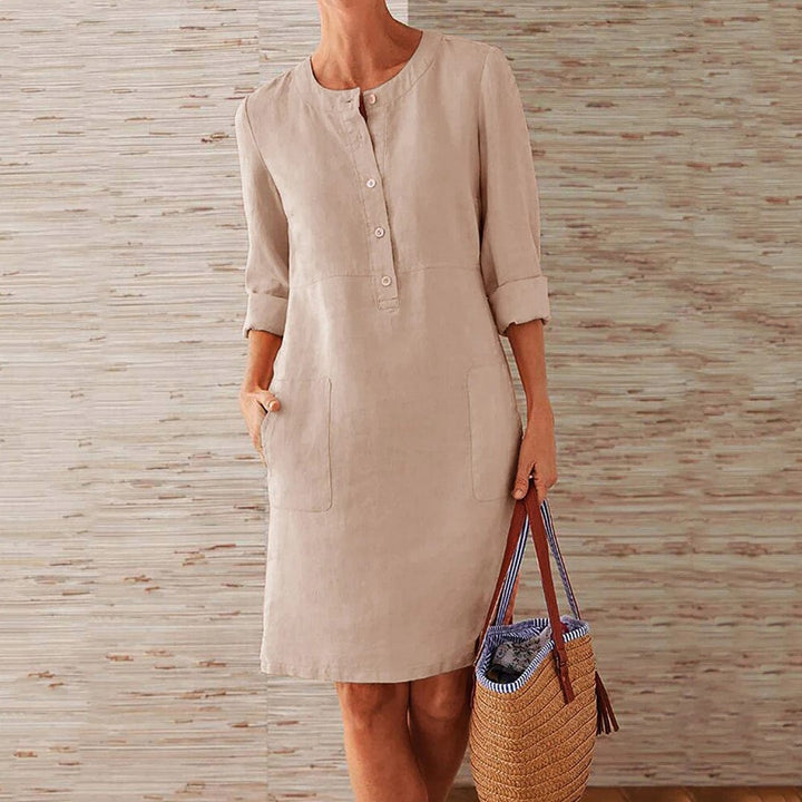 Sky blue women's casual midi dress with long sleeves and side pockets, featuring a round neckline, perfect for everyday wear.