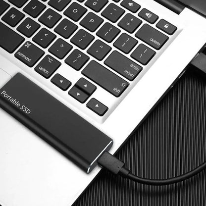 "Sleek 4TB USB-C external drive with slim metal casing, ideal for portable storage, compatible with PC and Mac."
