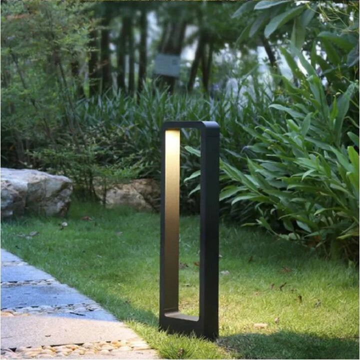 "Sleek aluminium outdoor garden light, weatherproof IP68 design, available in black or grey, enhances patios and pathways."