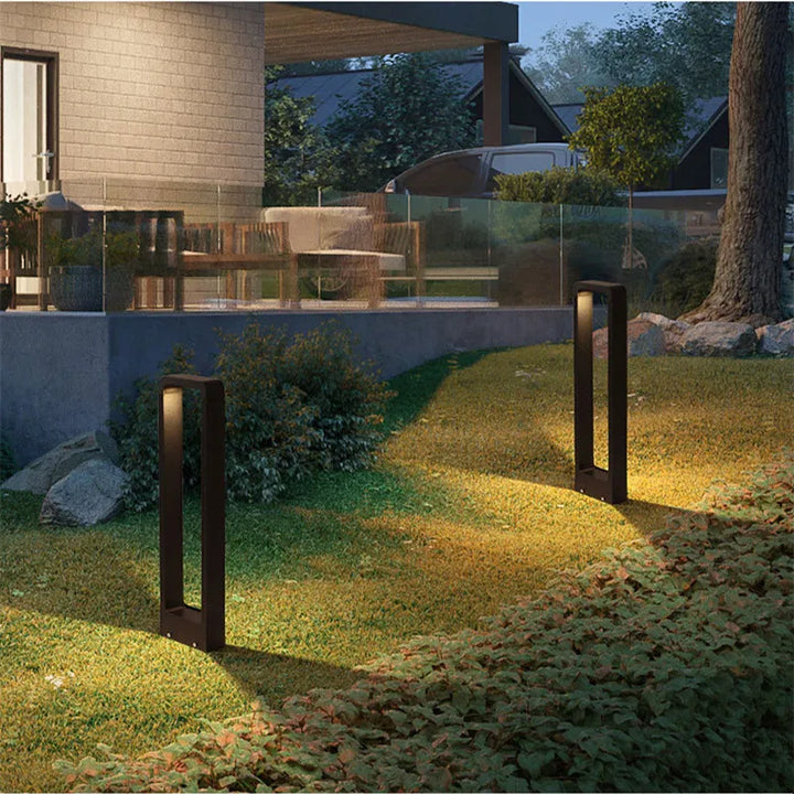 "Sleek aluminium outdoor garden light, weatherproof IP68 design, available in black or grey, enhances patios and pathways."
