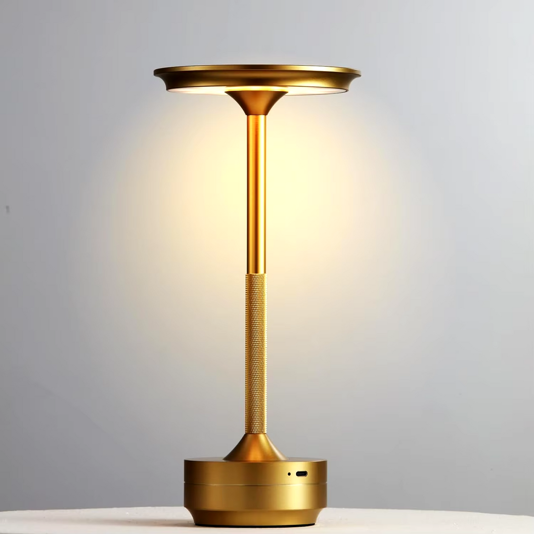"Sleek cordless LED table lamp with a touch sensor, featuring a minimalist design in available colors: black, gold, silver."