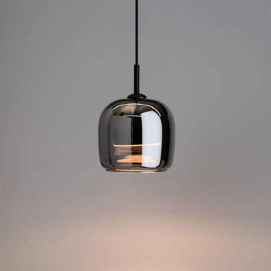 "Sleek Nordic black glass LED pendant light for modern interiors, perfect for kitchen or bedroom, adds elegance and warm glow
