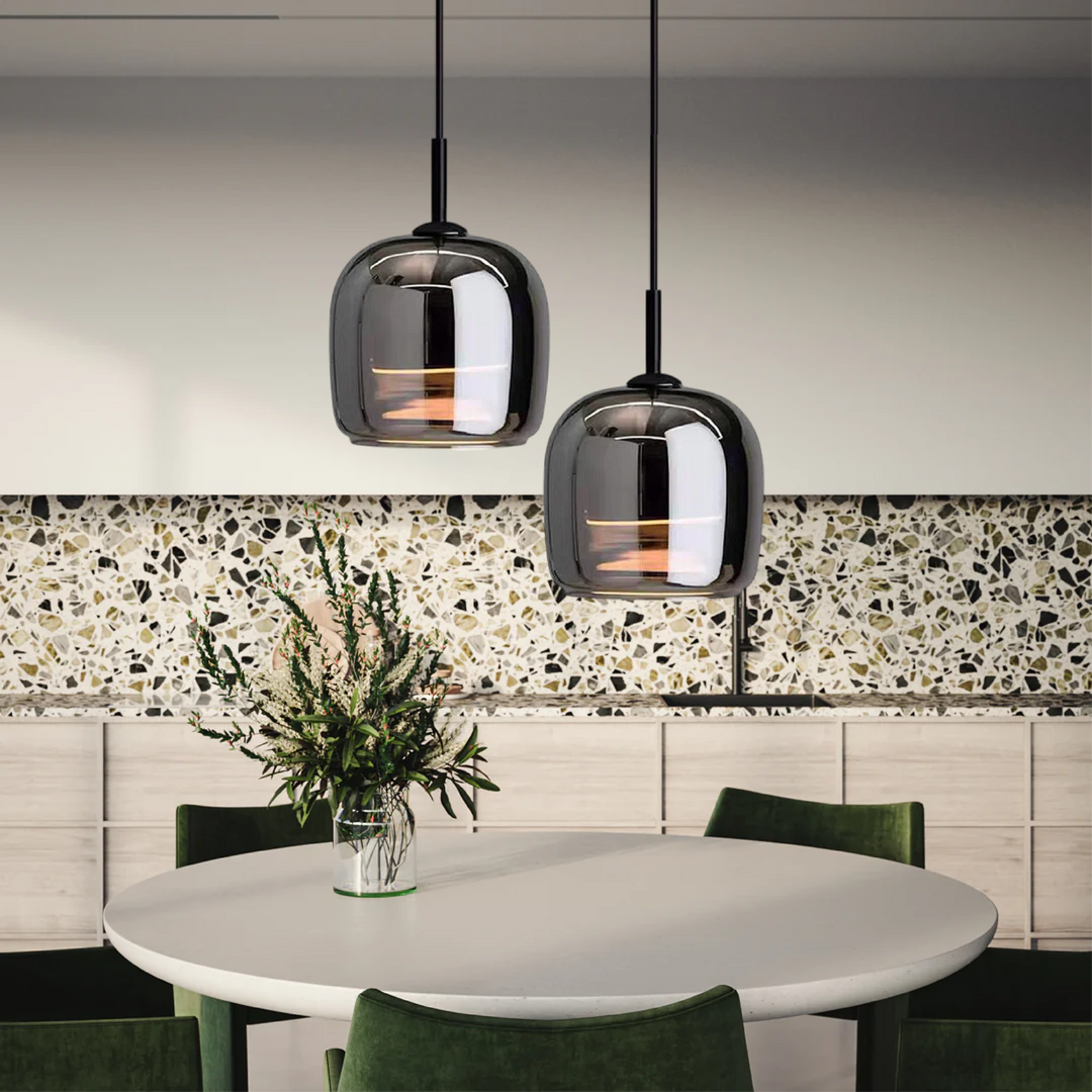 "Sleek Nordic black glass LED pendant light for modern interiors, perfect for kitchen or bedroom, adds elegance and warm glow