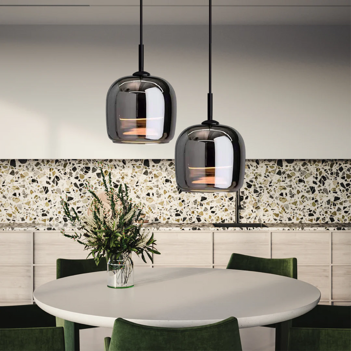 "Sleek Nordic black glass LED pendant light for modern interiors, perfect for kitchen or bedroom, adds elegance and warm glow