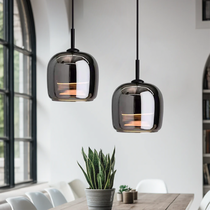 "Sleek Nordic black glass LED pendant light for modern interiors, perfect for kitchen or bedroom, adds elegance and warm glow