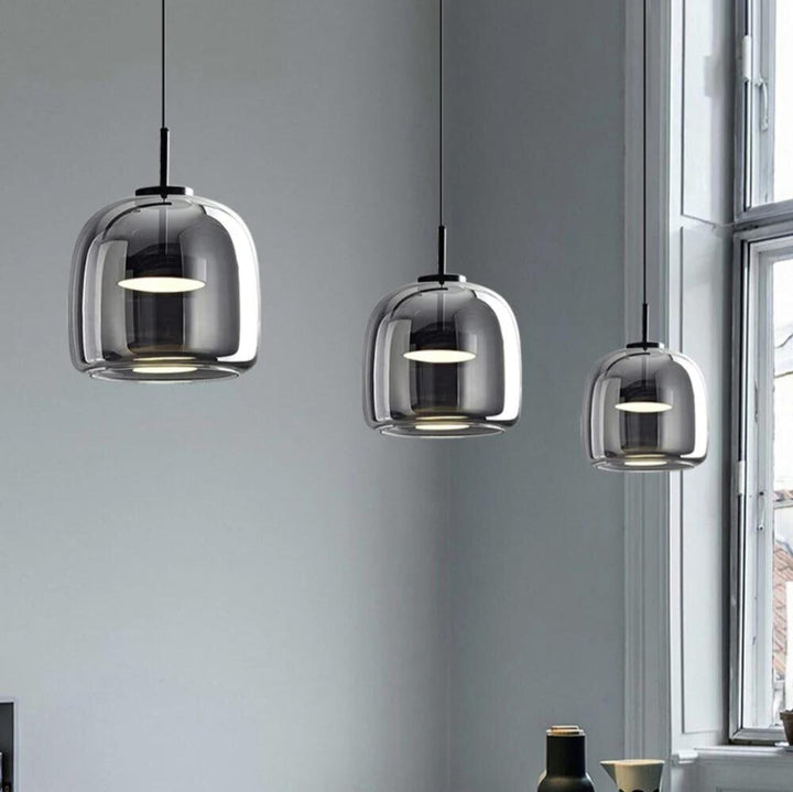 "Sleek Nordic black glass LED pendant light for modern interiors, perfect for kitchen or bedroom, adds elegance and warm glow