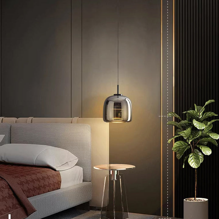 "Sleek Nordic black glass LED pendant light for modern interiors, perfect for kitchen or bedroom, adds elegance and warm glow