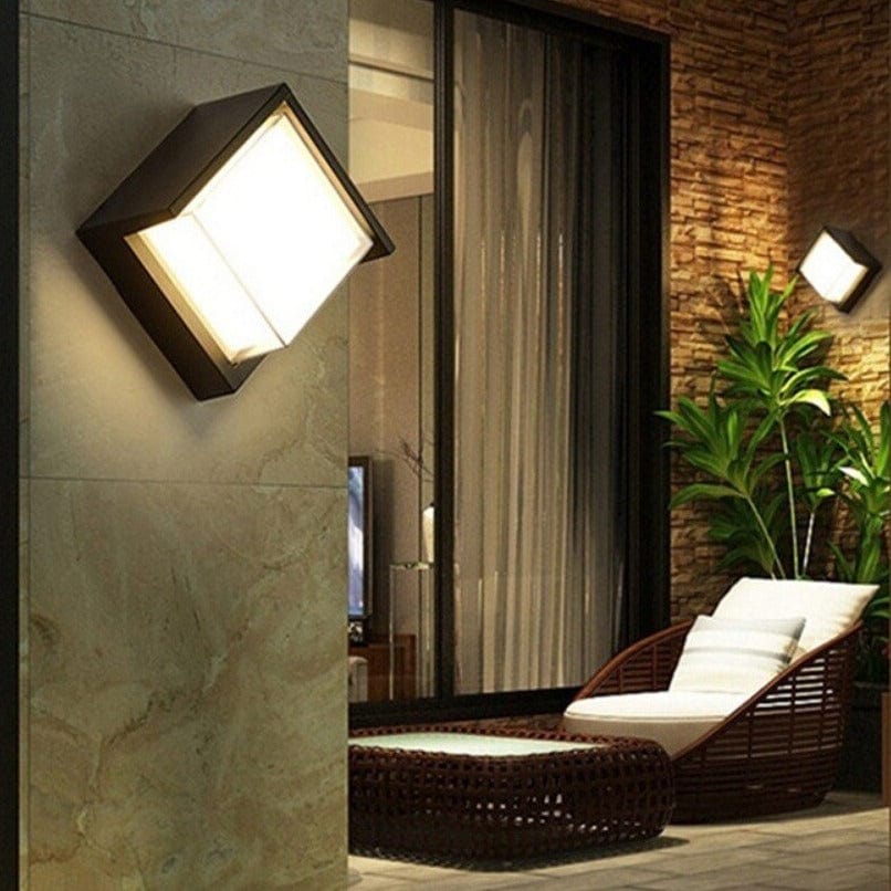 Sleek outdoor wall lamp with motion sensor and LED light, featuring IP65 waterproof rating and minimalist geometric design.
