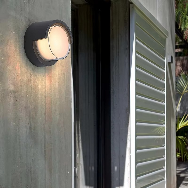 Sleek outdoor wall lamp with motion sensor and LED light, featuring IP65 waterproof rating and minimalist geometric design.