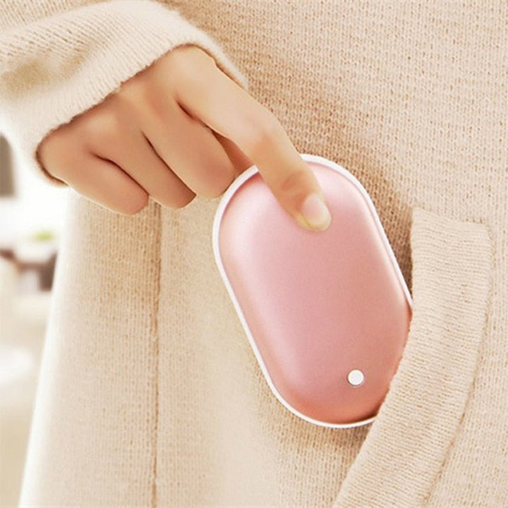 "Sleek silver portable USB hand warmer and powerbank, compact size, double-sided heating, ideal for chilly outdoor use."