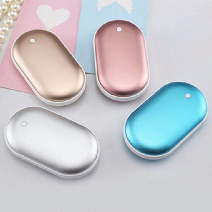"Sleek silver portable USB hand warmer and powerbank, compact size, double-sided heating, ideal for chilly outdoor use."