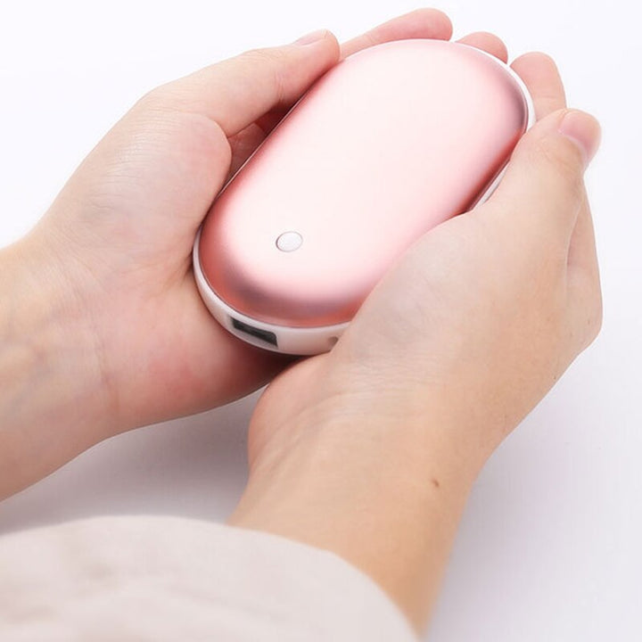 "Sleek silver portable USB hand warmer and powerbank, compact size, double-sided heating, ideal for chilly outdoor use."