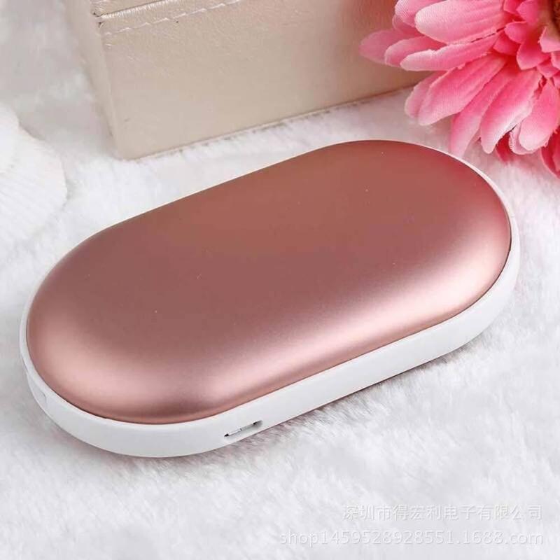 "Sleek silver portable USB hand warmer and powerbank, compact size, double-sided heating, ideal for chilly outdoor use."
