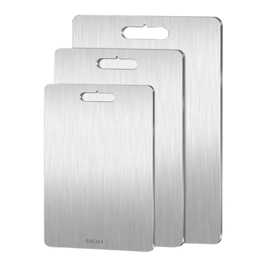 "Sleek stainless steel cutting board in use, showing durability and knife-friendly surface for kitchen prep tasks."