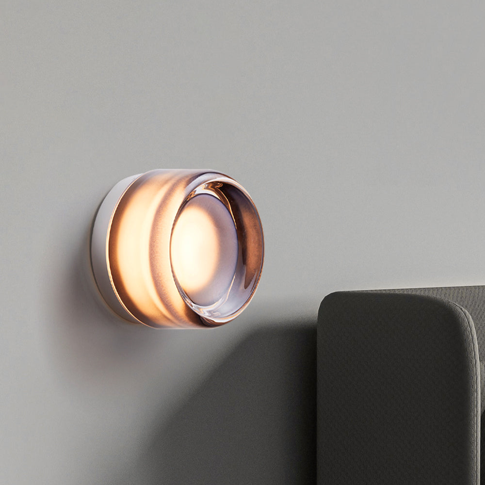 "Sleek wall mounted LED sconce light with acrylic and aluminum design, offering versatile decor enhancement for modern interi
