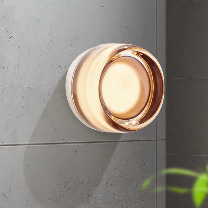 "Sleek wall mounted LED sconce light with acrylic and aluminum design, offering versatile decor enhancement for modern interi