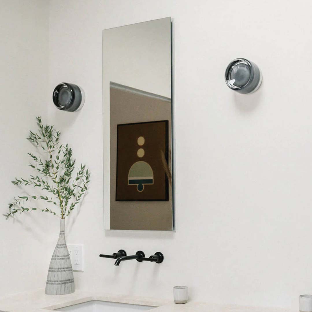 "Sleek wall mounted LED sconce light with acrylic and aluminum design, offering versatile decor enhancement for modern interi