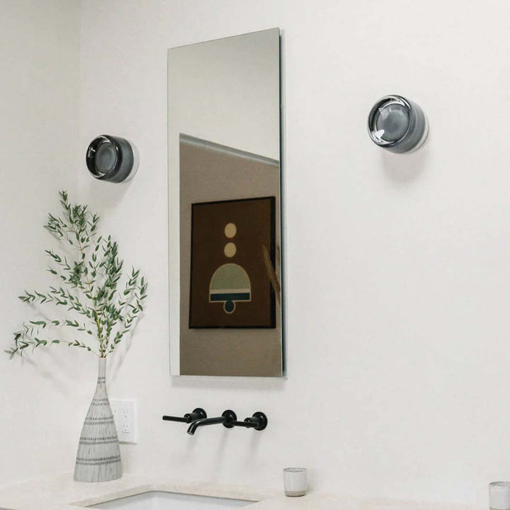 "Sleek wall mounted LED sconce light with acrylic and aluminum design, offering versatile decor enhancement for modern interi