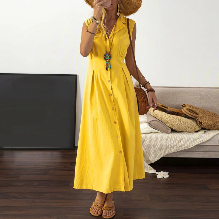 Sleeveless A-Line V-neck midi dress with collared neckline and button-down front, ideal for versatile, elegant styling.