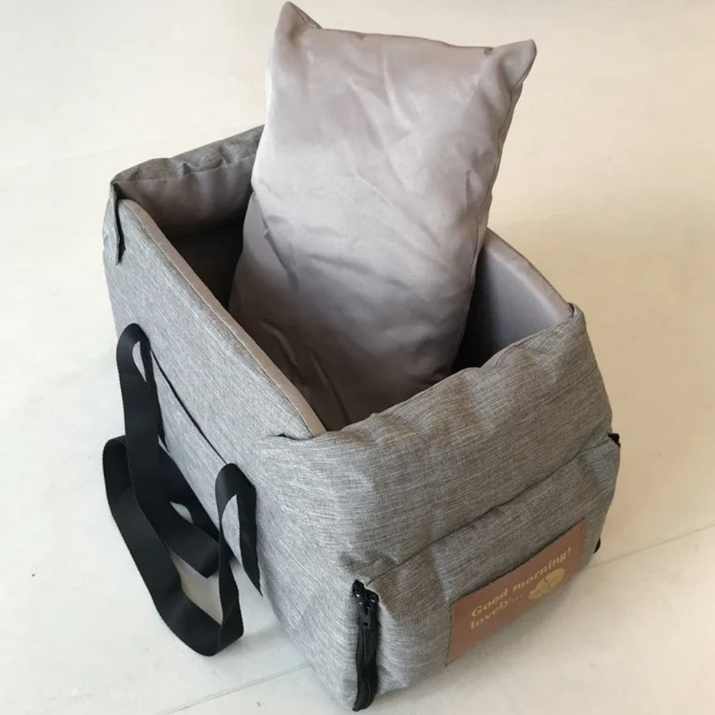 "Small Dog Cosy Car Seat Carrier Basket with padded interior, sleek design, fits securely in car for safe pet travel."