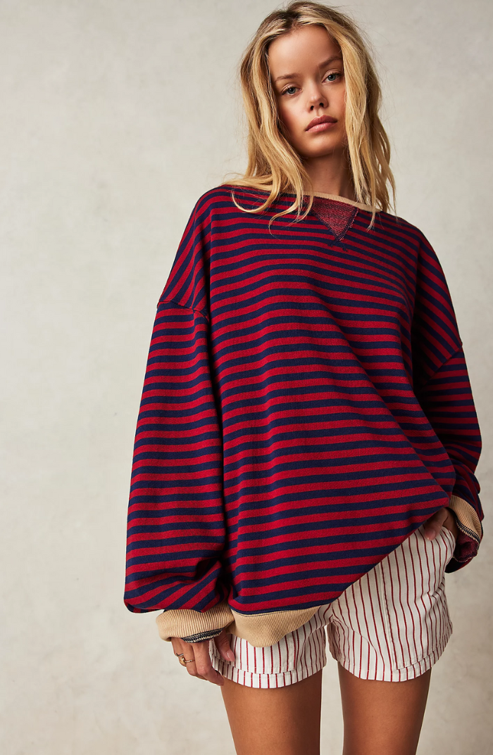 "Soft women's striped crewneck sweater, high-quality material, timeless design, versatile fashion for casual wear."