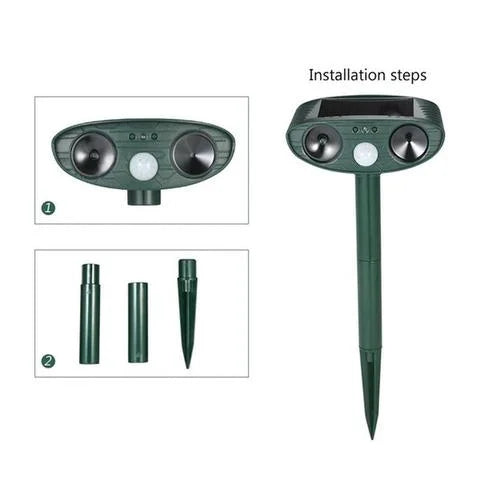 Solar-powered ultrasonic deer repeller with green casing, motion sensor, solar panel, ideal for outdoor garden protection.