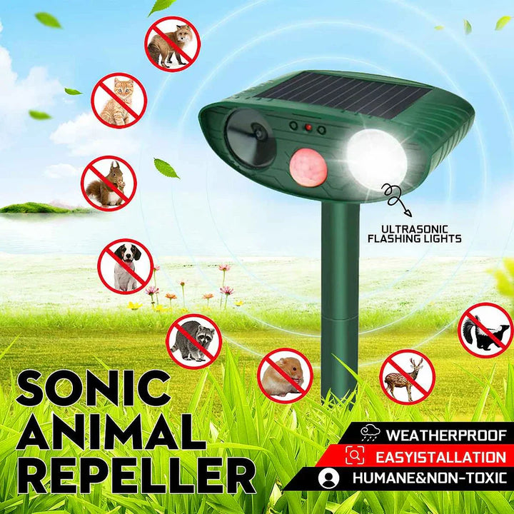 Solar-powered ultrasonic deer repeller with green casing, motion sensor, solar panel, ideal for outdoor garden protection.