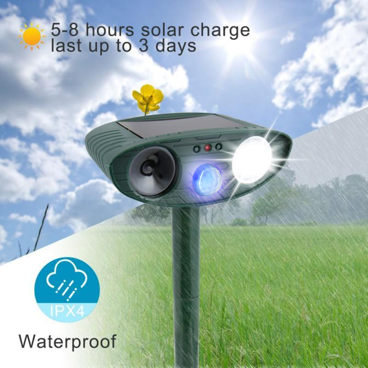 Solar-powered ultrasonic deer repeller with green casing, motion sensor, solar panel, ideal for outdoor garden protection.