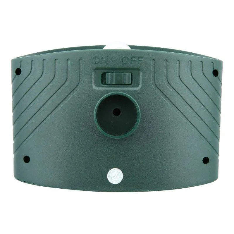Solar-powered ultrasonic deer repeller with green casing, motion sensor, solar panel, ideal for outdoor garden protection.