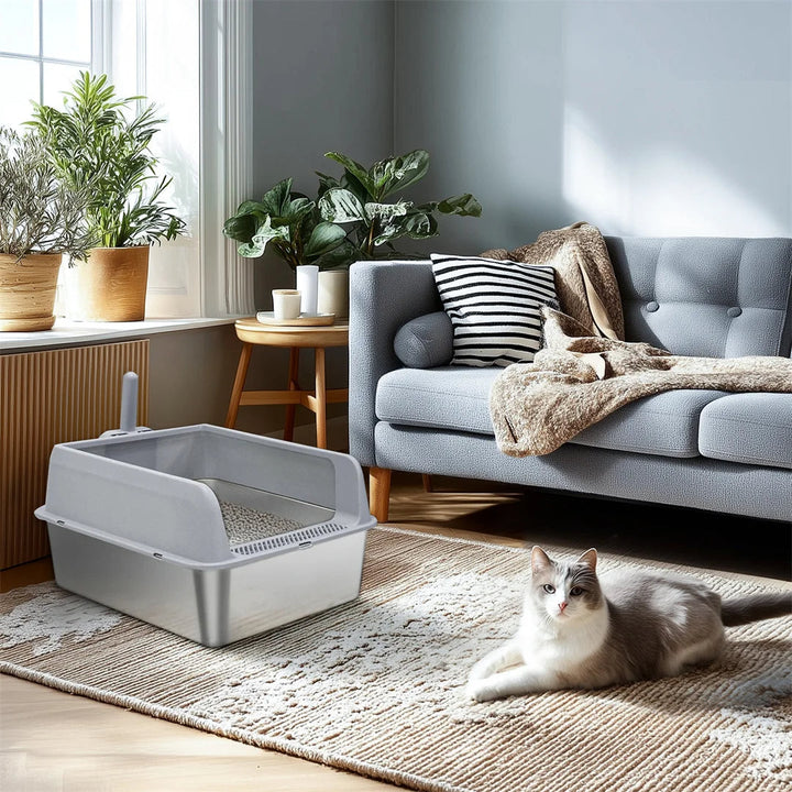 "Stainless steel cat litter box with easy front access and tall sides, ideal for hygienic pet spaces and easy maintenance."