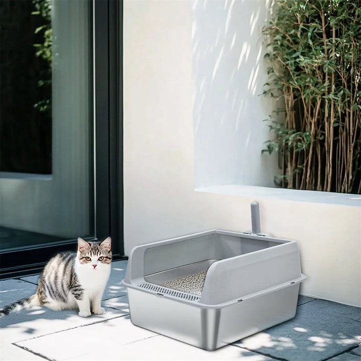 "Stainless steel cat litter box with easy front access and tall sides, ideal for hygienic pet spaces and easy maintenance."